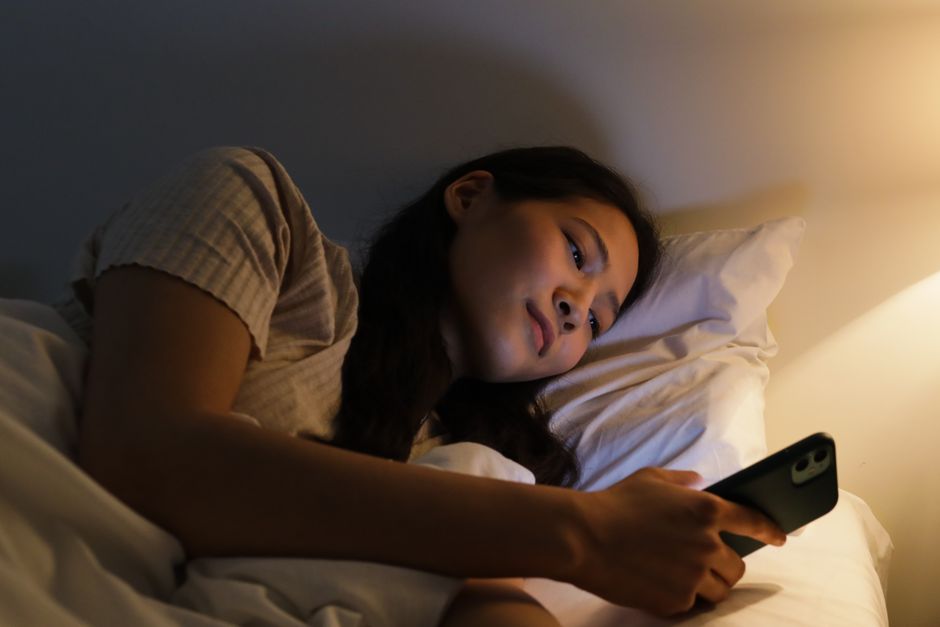 Person using a smartphone at night
